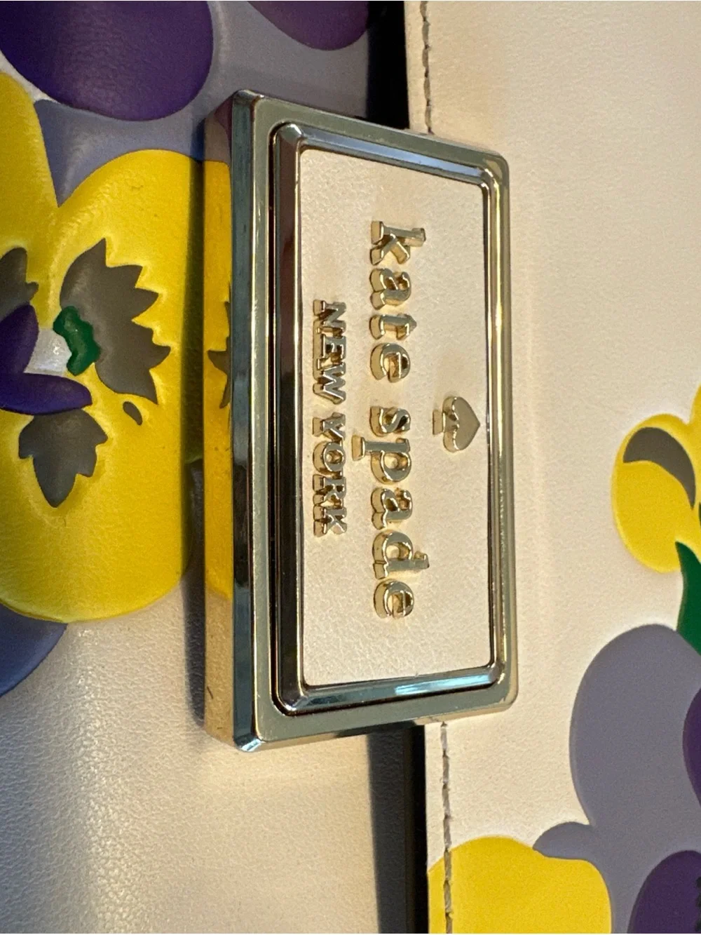 Kate Spade New York Reegan Pansy cream wallet with purple and yellow floral